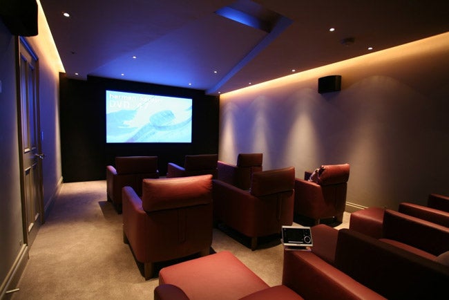 Home theater with Vutec Vu-Easy Projection Screen displaying content.Home theater with Vutec Vu-Easy projection screen displayed.
