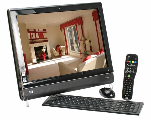 HP TouchSmart IQ500 All-In-One PC with keyboard and remote control.