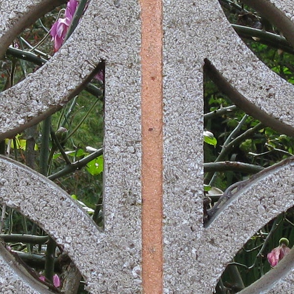 Close-up of a weathered garden wheel.Close-up of a wheel detailing with worn texture.