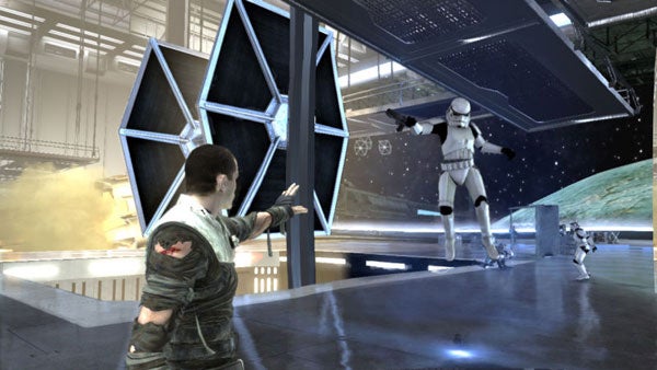 Star Wars game character using force on a stormtrooper and TIE fighter.