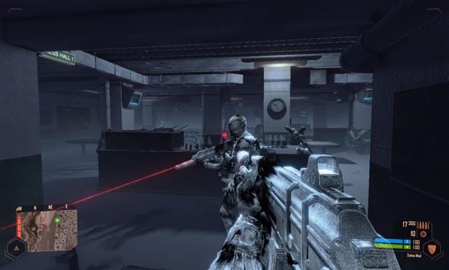Crysis Warhead gameplay screenshot showing player in combat situation.Screenshot of Crysis Warhead gameplay with soldier aiming laser gun.