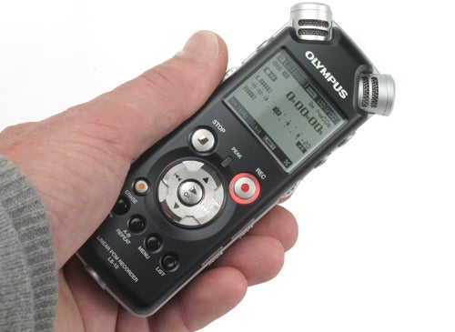 Hand holding an Olympus LS-10 Linear PCM Recorder.