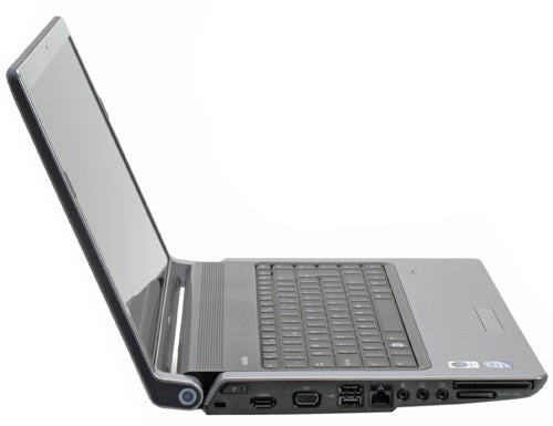 Dell Studio 15 laptop with screen open and ports visible.Dell Studio 15 notebook with side ports visible.