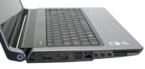 Dell Studio 15 laptop showcasing keyboard and side ports.Dell Studio 15 laptop side view showcasing ports and keyboard.