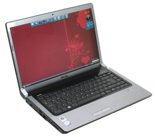 Dell Studio 15 laptop with red wallpaper on display