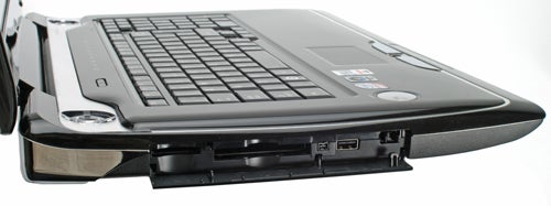 Toshiba Qosmio G50-115 notebook side view highlighting ports.Side view of Toshiba Qosmio G50-115 entertainment notebook.
