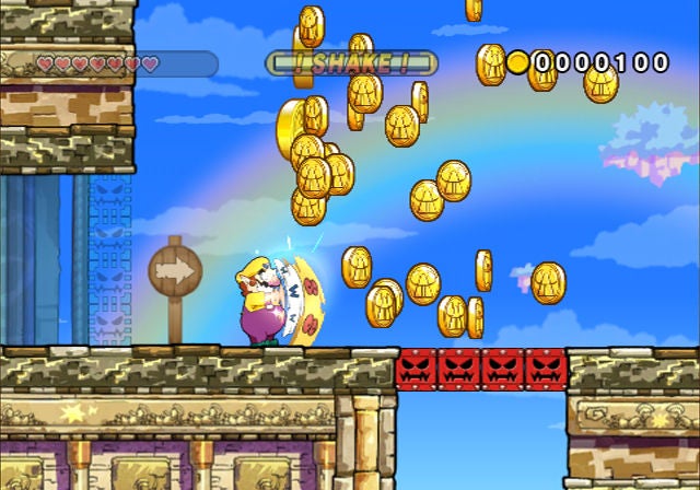 Screenshot of gameplay from Wario Land: The Shake Dimension.Wario collecting coins in Wario Land: The Shake Dimension game.