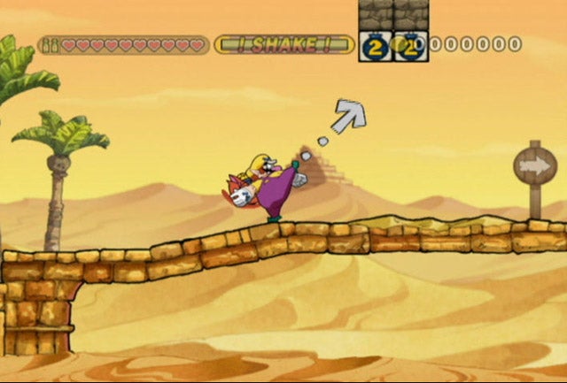Wario running and jumping in Wario Land: The Shake Dimension game.Screenshot of Wario jumping in Wario Land: The Shake Dimension game.