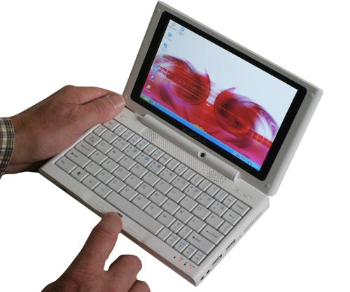 Person holding a Raon Digital Everun Note mini-laptop.