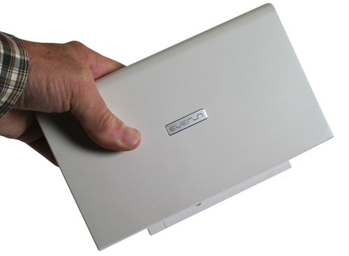 Hand holding a closed Raon Digital Everun Note mini-notebook.