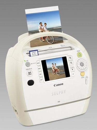 Canon Selphy ES3 printer with a photo being printed.