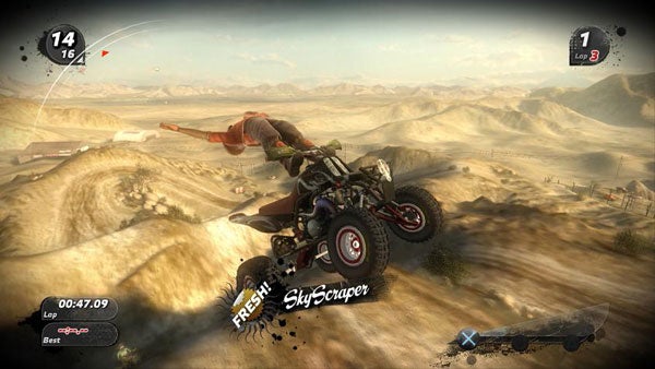 Motocross video game screenshot showing mid-air stunt over desert hills.