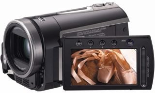 JVC Everio GZ-MG730 camcorder with ballet shoes on display.