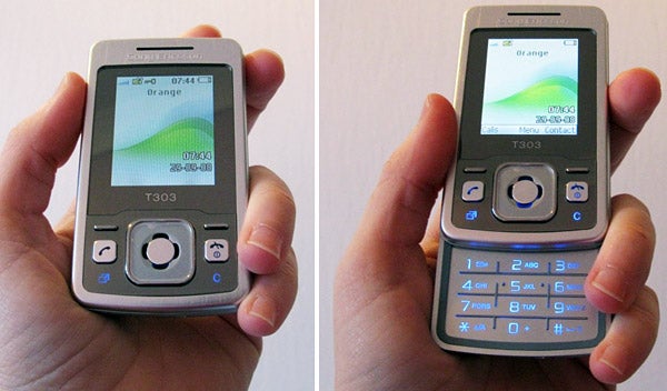 Person holding a Sony Ericsson T303 mobile phone.