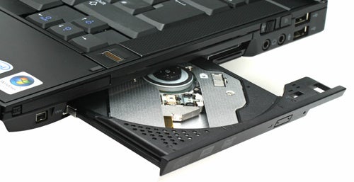 Dell Latitude E6400 laptop with open optical drive.