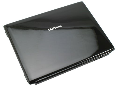 Samsung Q310 notebook closed on white background.