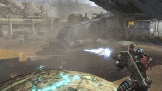 Character in a video game using futuristic weapon.