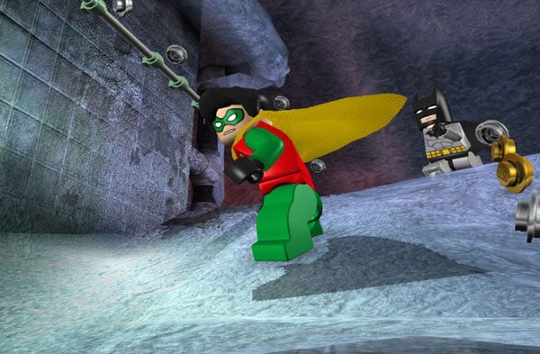 Lego Batman and Robin in a video game scene.