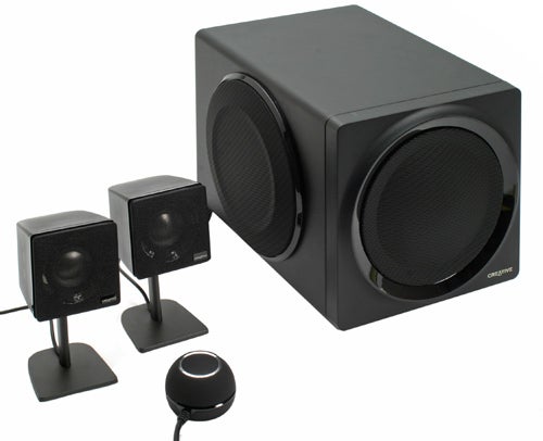 Creative GigaWorks T3 speakers and subwoofer on white background.