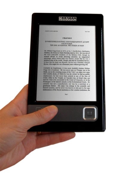 Hand holding a Bookeen Cybook Gen3 e-reader displaying text.