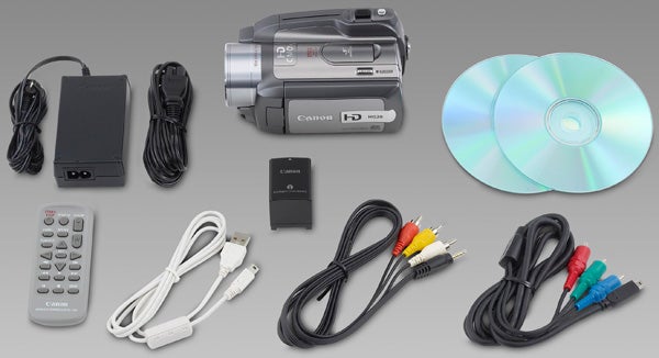 Canon HG20 camcorder and included accessories displayed on gray background