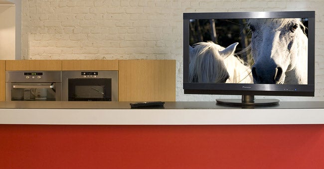 Pioneer KURO TV displaying horse image in modern kitchen setting.