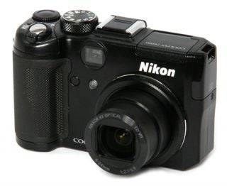 Nikon CoolPix P6000 digital camera on white background.