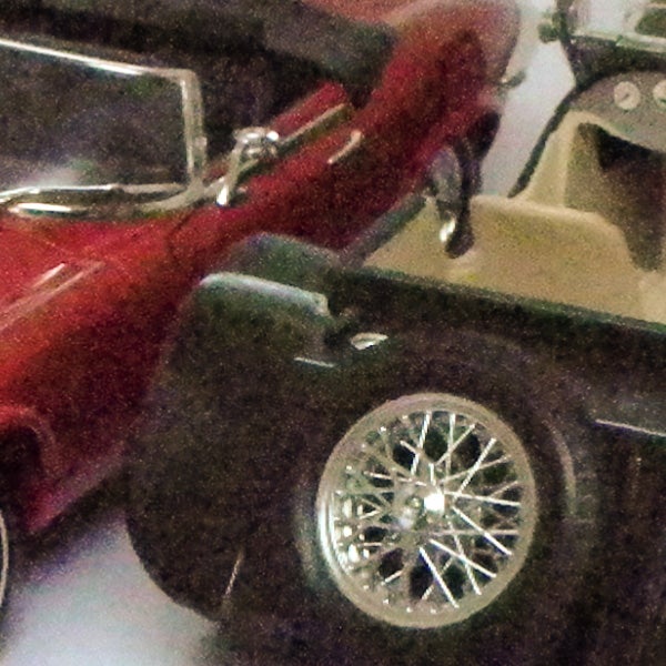 Close-up of model cars showcasing camera's zoom capability.