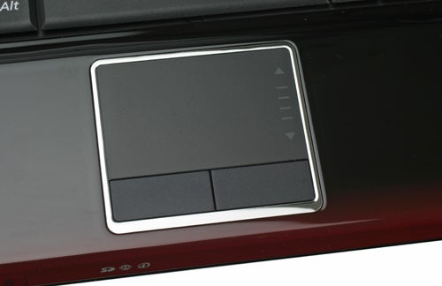 Close-up of Samsung R560 notebook touchpad and keyboard area.