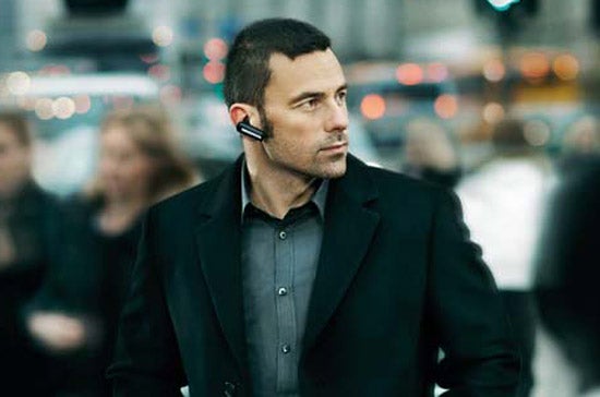 Man wearing Jabra BT530 Bluetooth Headset in urban setting.