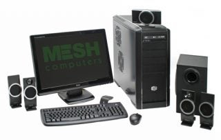 Mesh Xtreme GTX300 computer setup with monitor and speakers.