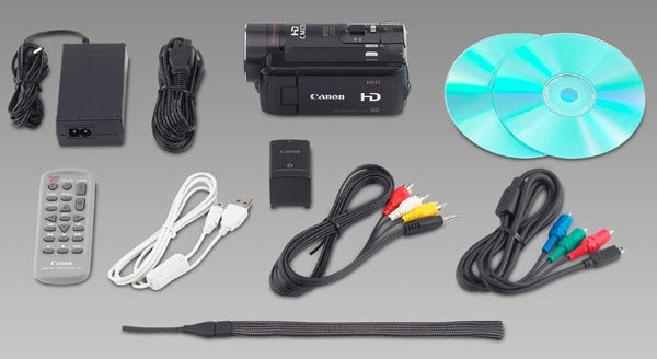 Canon HF11 camcorder with accessories and cables.