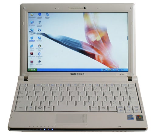 Samsung NC10 netbook with screen on showing desktop.