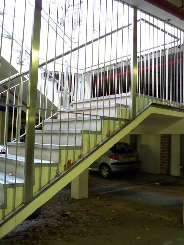 Photo taken with Kodak EasyShare M1093 IS showing a stairwell and parked car.
