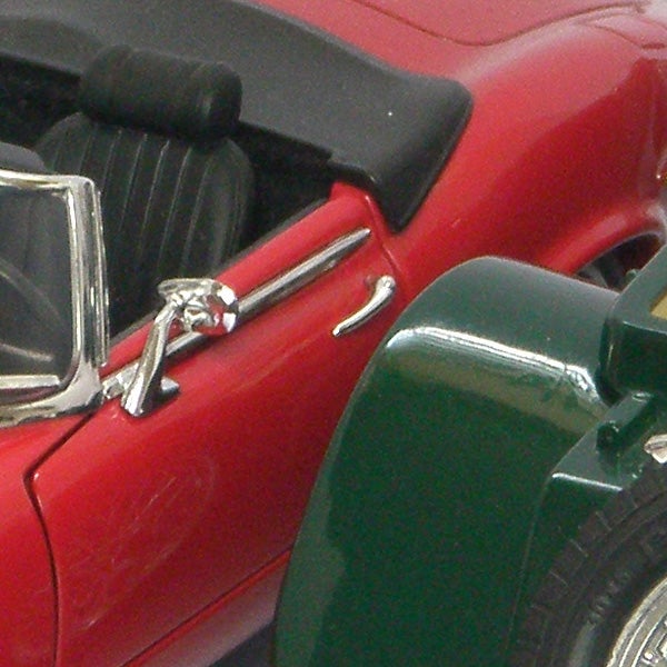 Close-up of a red and green toy model car