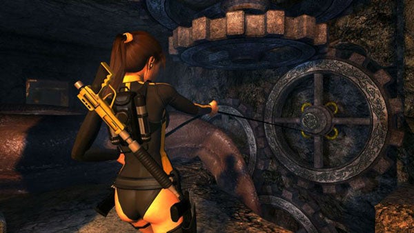 Lara Croft interacting with puzzle in Tomb Raider: Underworld.