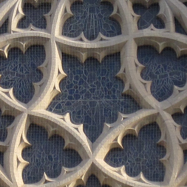 Close-up of intricate gothic window architecture.
