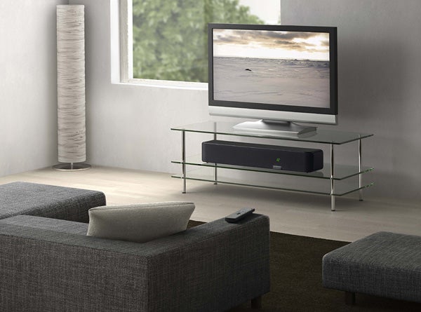 Denon DHT-FS5 soundbar under TV in modern living room.