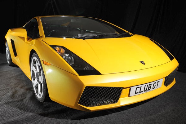 Yellow Lamborghini Gallardo with 'CLUB GT' license plate.
