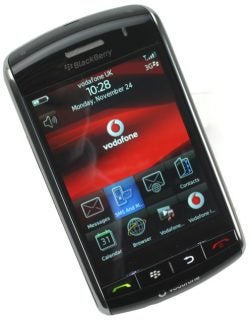BlackBerry Storm smartphone displaying home screen with icons.