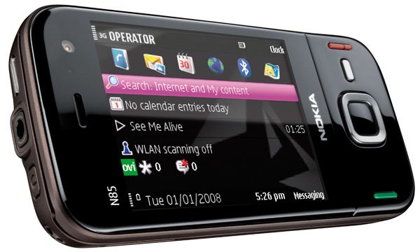 Nokia N85 smartphone displaying screen icons and date.