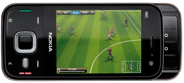 Nokia N85 smartphone displaying a soccer game screen.