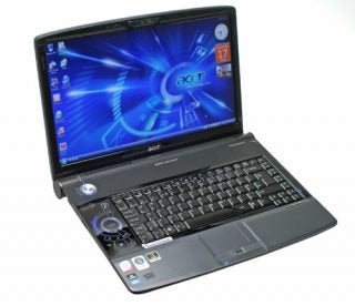 Acer Aspire 6935G laptop with open screen displaying desktop.