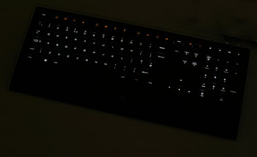 Backlit Logitech Illuminated Keyboard in low-light setting.