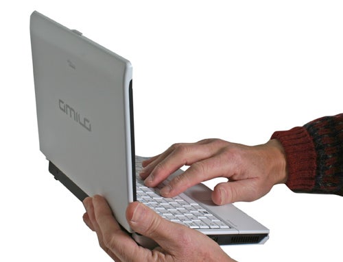 Person using Fujitsu-Siemens Amilo Mini Ui 3520 laptop.