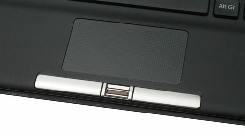 Close-up of Sony VAIO VGN-TT11WN/B laptop's touchpad and hinges.