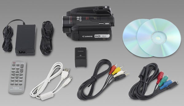 Canon HG21 camcorder and accessories displayed on a gray background.