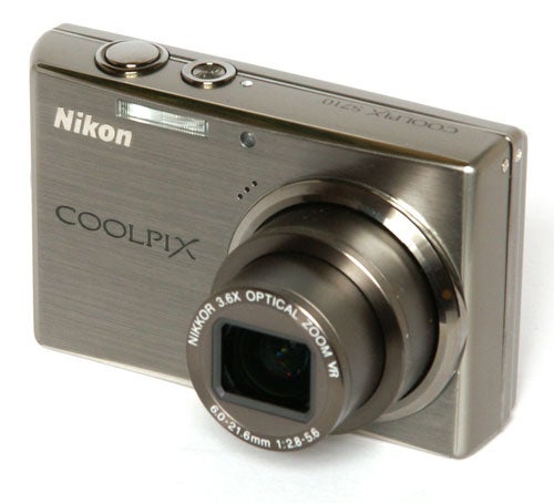 Nikon CoolPix S710 digital camera on white background.