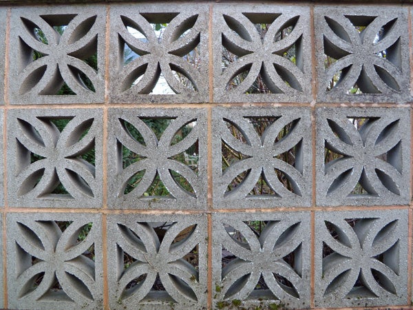 Decorative concrete blocks with leaf-like patterns.