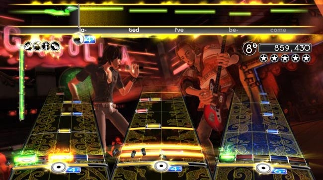 Rock Band 2 gameplay screen with high score and two avatars.